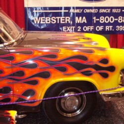 A car with flames painted on it.
