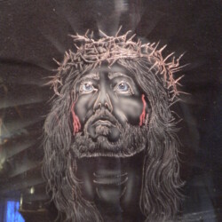 A t - shirt with a picture of jesus on it.