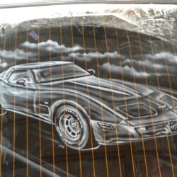 A drawing of a car on the side of a car.