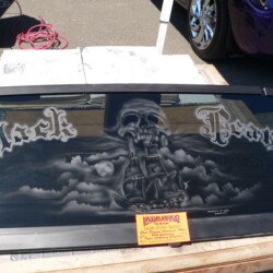 A car window with a pirate on it.