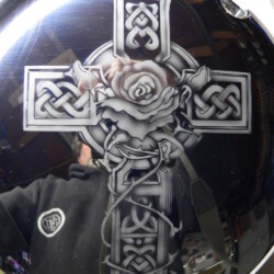 A motorcycle with a cross on it.