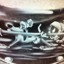 A picture of a drum with a cartoon character on it.