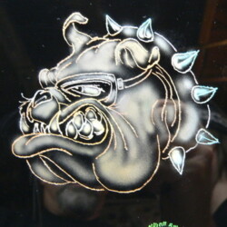 An image of a bulldog with spikes on his head.