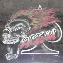 A drawing of a skull with flames on it.