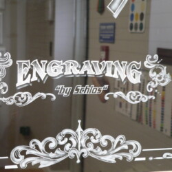 A sign that says engrave my studio.