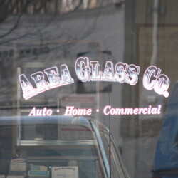 A car parked in front of a store.