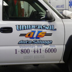 A white truck parked in a garage.