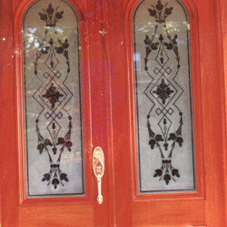 A red door with a decorative design on it.