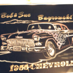 A black and white picture of a chevrolet car.