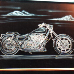 A picture of a motorcycle with mountains in the background.