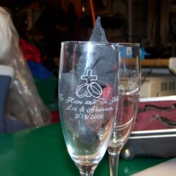 Two wine glasses on a table.