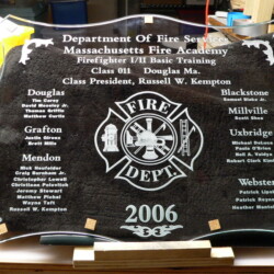 A glass plaque with a firefighter on it.