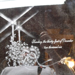 A glass plaque with a picture of a man and a woman.