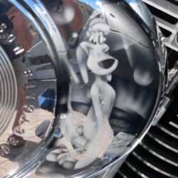 A close up of a motorcycle with a cartoon character on the hood.