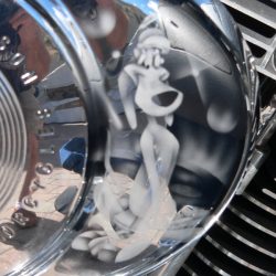 A close up of a motorcycle with a cartoon character on the hood.