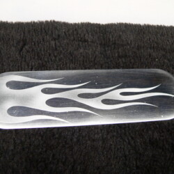 A metal plate with flames on it.