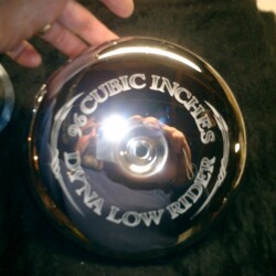 A picture of a motorcycle with a chrome plate on it.