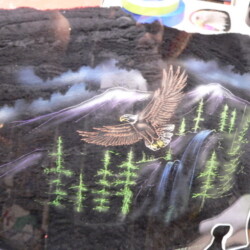 An image of an eagle with a mountain in the background.