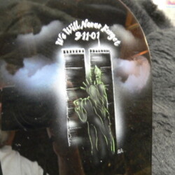 A black object with a drawing on it.