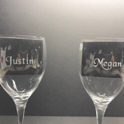 Two wine glasses with the words justin and megan on them.