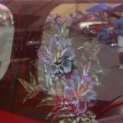 A car window with a flower design on it.