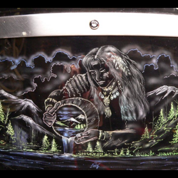 A drum with an image of a woman holding a drum.