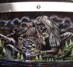 A drum with an image of a woman holding a drum.