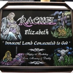 A plaque with the name rachel elizabeth innocent lamb committed to god.