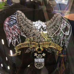 A sticker with an eagle and an american flag on it.