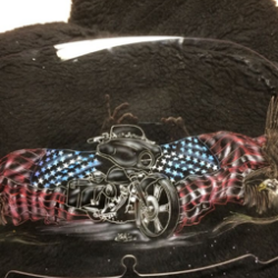 A motorcycle helmet with an american flag and eagles on it.