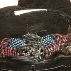 A motorcycle helmet with an american flag and eagles on it.