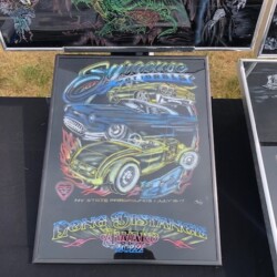 A display of framed art on a table.